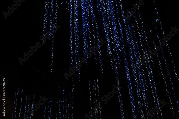 Fototapeta Blue lights abstract pattern background which look like digital binary bits streaming