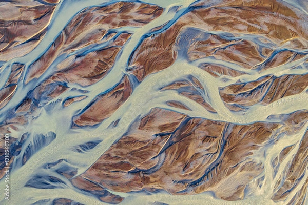 Fototapeta Abstract aerial view of rivers emerging from Icelandic glaciers. Mother nature has created stunning works of art in Iceland. high quality photo for a wallpaper backdrop