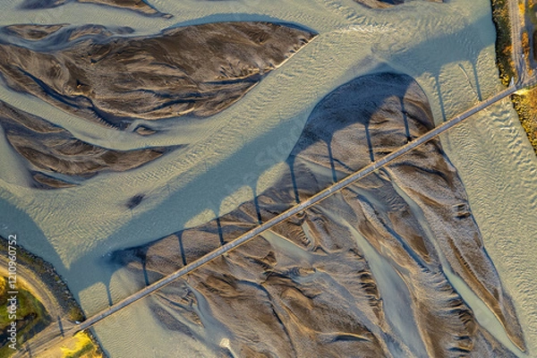 Fototapeta Abstract aerial view of rivers emerging from Icelandic glaciers. Mother nature has created stunning works of art in Iceland. high quality photo for a wallpaper backdrop