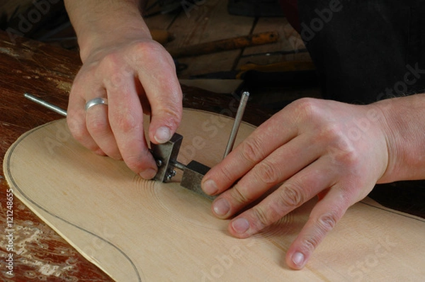 Obraz Luthier makes installation rosette classical guitar