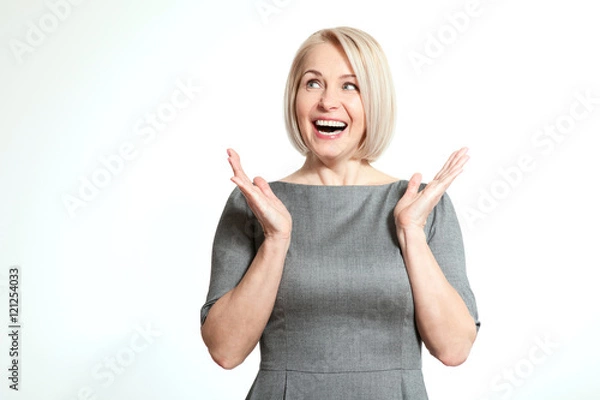 Obraz Surprised woman over white background. Human face expression, emotions, feeling attitude reaction