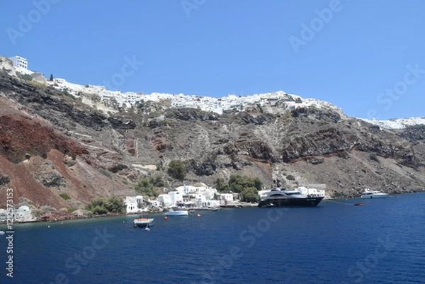 Obraz A luxury yacht and sail boat cruising in the crater of Santorini Island in the Mediterranean Sea, Greece