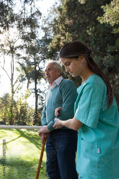 Fototapeta nurse helping a elder man