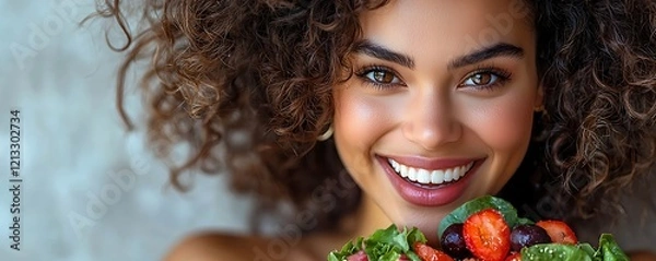 Fototapeta Excited person eating a colorful salad, highlighting healthy and happy eating habits on a light background