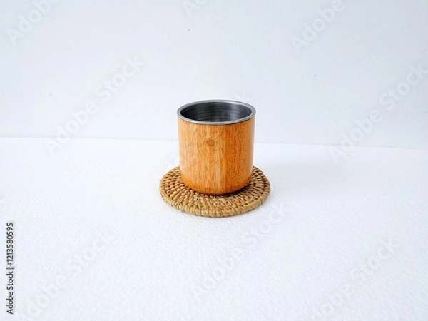 Fototapeta handicrafts from leftover wood in the form of glasses and cups. Aesthetic wooden glasses are suitable for cafes, restaurants and homes. on a white background