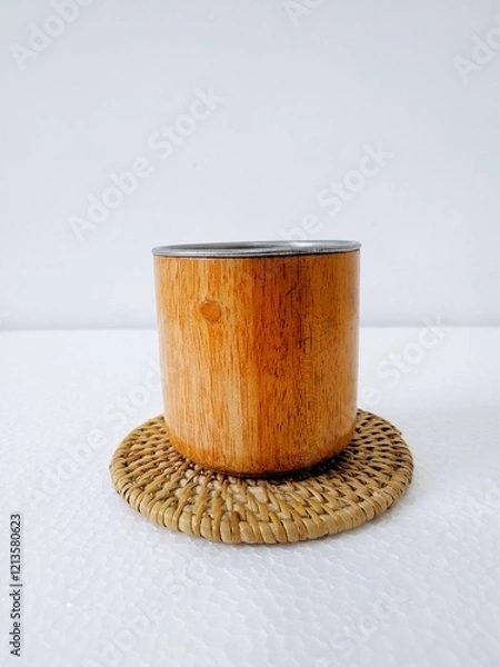 Obraz handicrafts from leftover wood in the form of glasses and cups. Aesthetic wooden glasses are suitable for cafes, restaurants and homes. on a white background