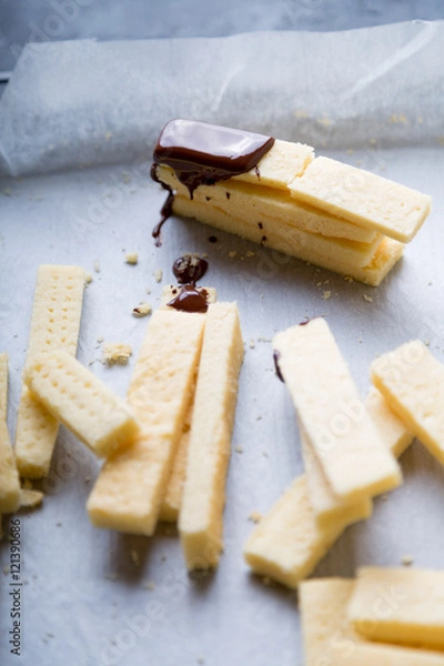 Fototapeta Stack of homemade english shortbread cookies with dark chocolate drips. Selective focus