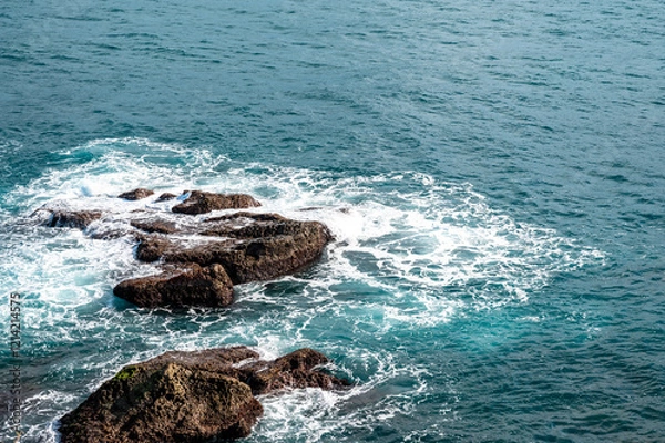 Obraz Wave splashing on the rocks near the coastline, in Keelung city, Taiwan.