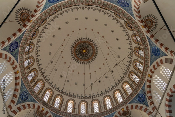 Fototapeta interior of historical Rustem Pasha Mosque at sunset. Ottoman architecture by Mimar Sinan shines amid peaceful rays, capturing a spiritual ambiance. Ramadan, islamic, muslim.