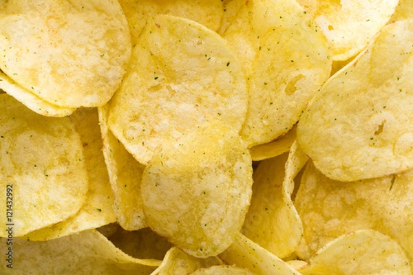 Fototapeta Close up potato chips on top view background.