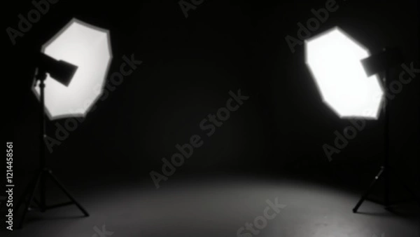 Fototapeta Soft light illuminates empty space in a dark studio ready for creativity and inspiration