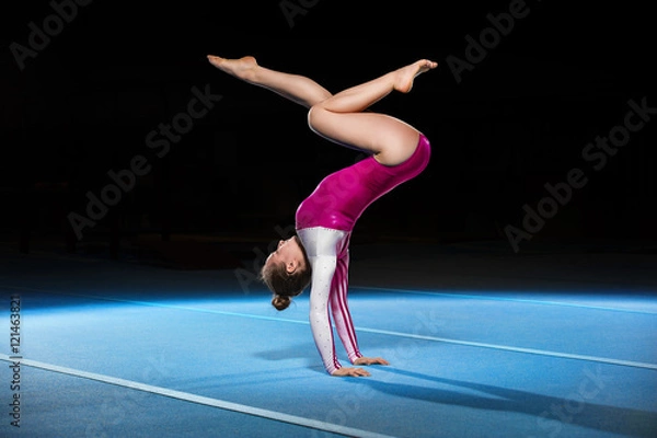 Obraz portrait of young gymnasts competing in the stadium