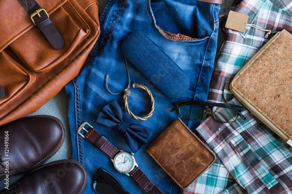Fototapeta Flat lay of men's casual outfits with accessories on gray background