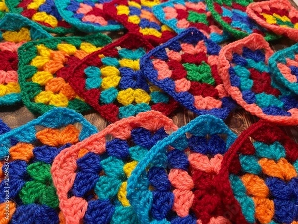 Fototapeta Crochet granny squares hobby handmade wool yarn objects decorative patterns om wooden background 