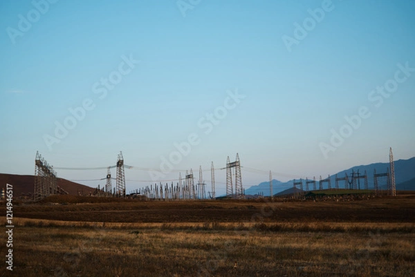 Fototapeta the power poles in the desert of Armenia with a view of the mountains