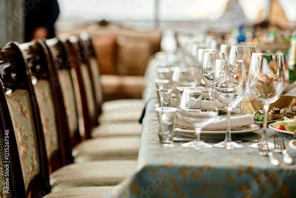Fototapeta Elegant Table Setting with Glassware and Plates.
