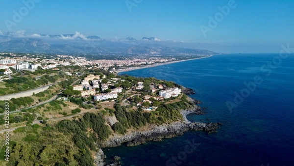 Fototapeta Scenographic aerial view of Calabria Cost with hypnotic blue color sea in summer time