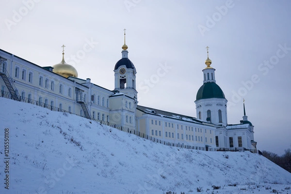 Fototapeta Large building with two domes and a clock tower