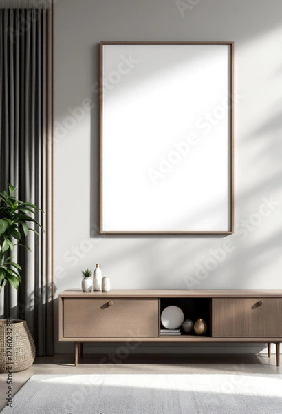 Obraz a large blank picture frame hanging on the wall above a wooden entertainment center with two drawers. Cozy modern living room with photo frame design
