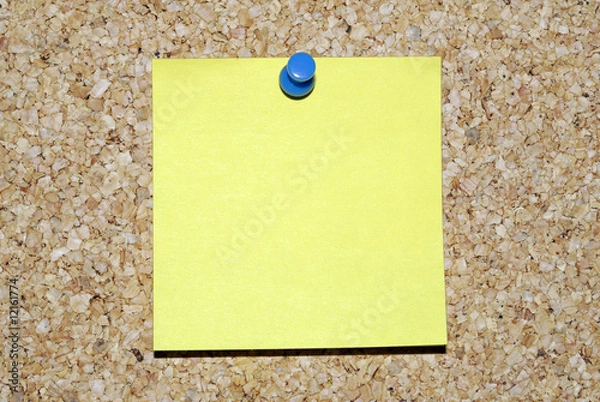 Obraz Blank yellow sticky note on corkboard