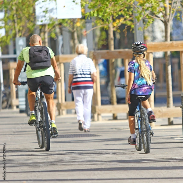 Fototapeta Père et fille en vélo