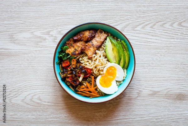 Obraz Japanese noodles bowl with chicken, carrots, avocado