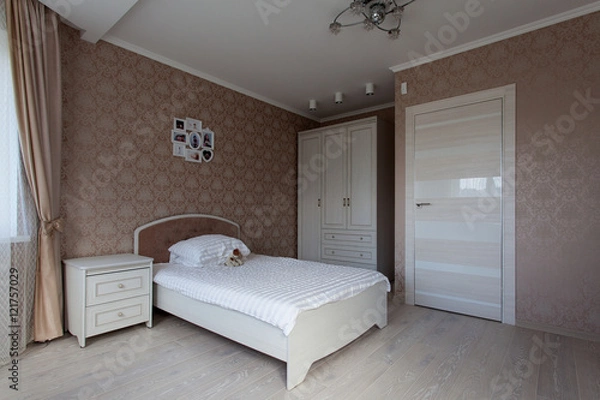 Fototapeta Interior of a bedroom in light brown tones for little girl