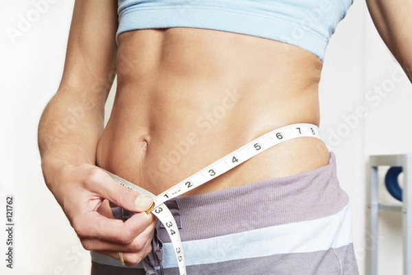 Obraz Dziewczyna mierząca talię