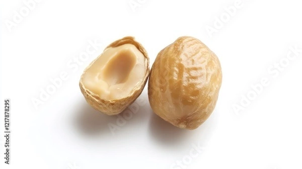 Fototapeta Close-up of a whole and halved hazelnut on white background.