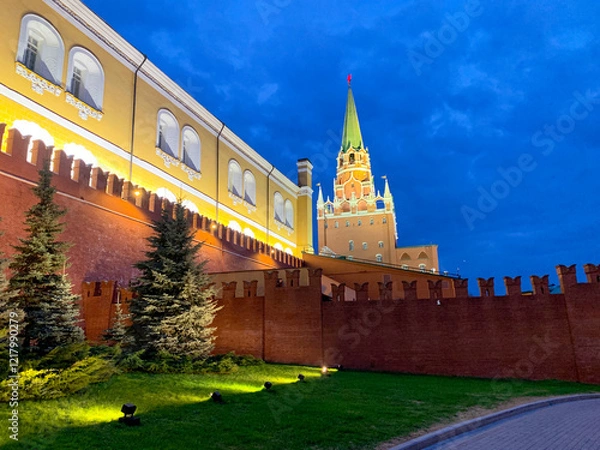 Fototapeta Large building with a green roof and a red roof