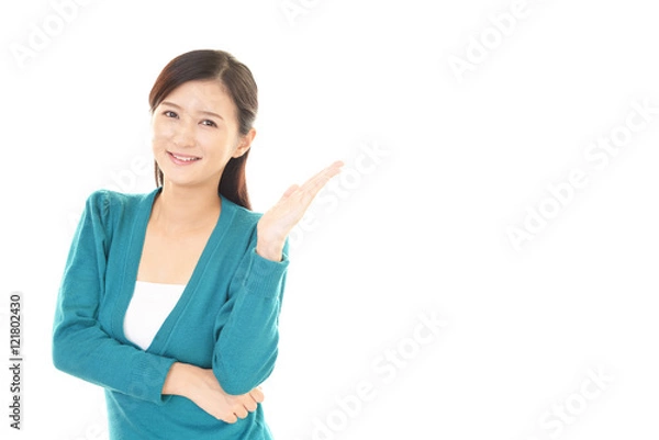 Fototapeta 案内する笑顔の女性