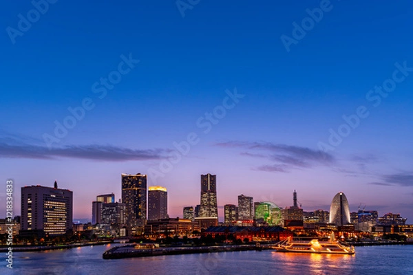 Fototapeta sweet sunset winter and light illumination from Cityscape of Yokohama city, Skyline and office building and downtown in  Minatomirai Area, Yokohama city port, Kanagawa, Japan