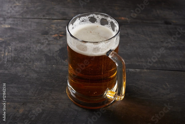 Fototapeta mug of beer on the table