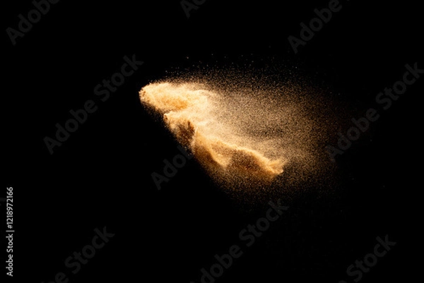 Obraz Sand flying explosion isolated on black background ,throwing freeze stop motion object design.