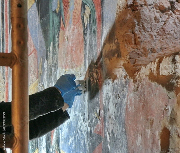 Fototapeta Restorer paintings on frescoes of religious motifs in Orthodox Christian monasteries	