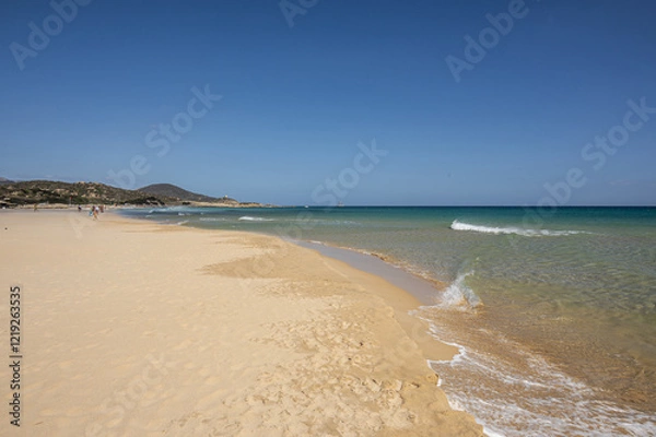 Obraz The beautiful beach of Su Giudeu in the south of Sardinia with transparent and turquoise water and a small island in front of the bay