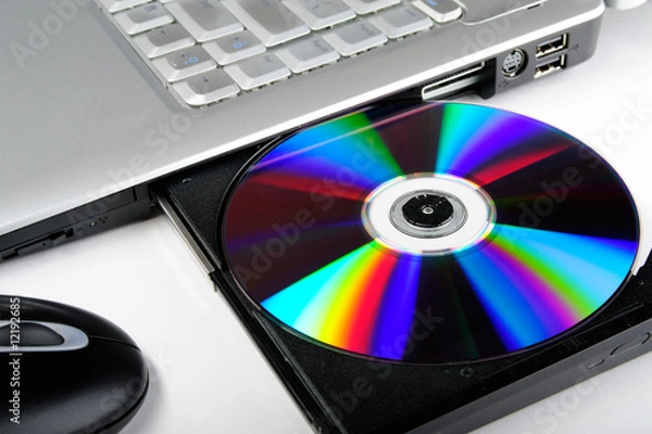 Fototapeta Laptop computer with compact disk