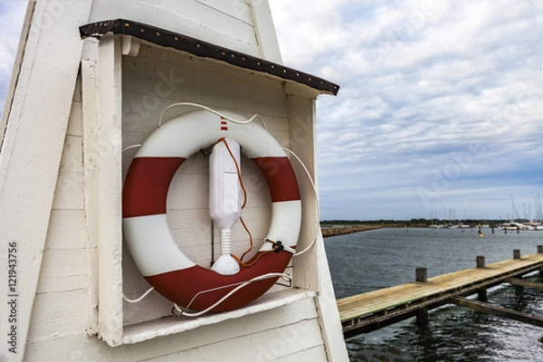 Obraz  Lifesaver by the harbor