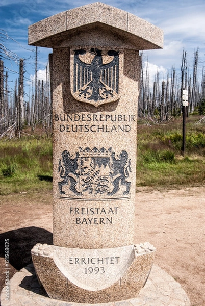 Fototapeta german side of border stone on Dreieckmark in Bavariant Forest with coat of arms of Germany and Bavaria