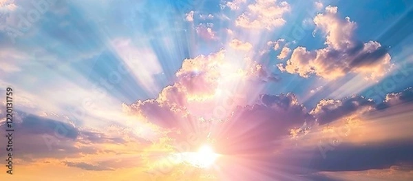 Fototapeta Heavenly sunrise. Peaceful pastel colors paint the sky as sun rays burst through the clouds.