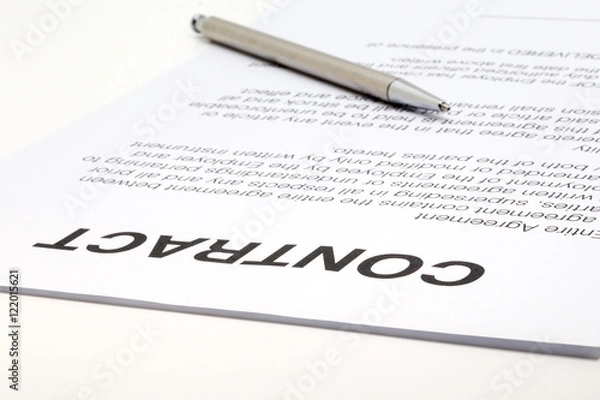 Fototapeta Closeup of a contract and a silver pen