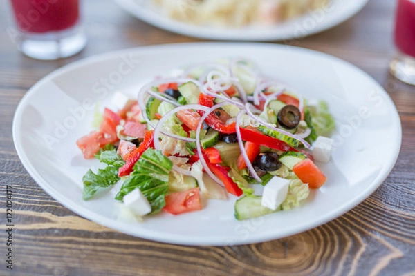 Fototapeta Greek salad with olives and cheese