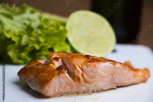 Obraz salmon with lemon and lettuce