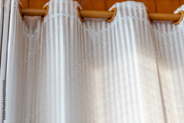 Fototapeta The background of the room or resort decoration with curtains, wooden chairs, and hook-type clothes hangers. The beauty and convenience of use.