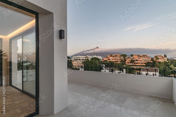 Obraz a landscape image overlooking the cloudy mountain of Marbella from luxury mediterranean real estate balcony 