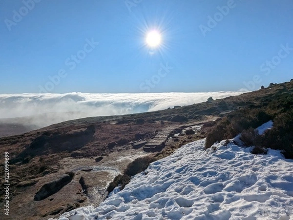 Fototapeta Above the clouds landscape in winter
