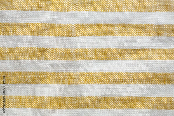 Fototapeta Yellow and white striped fabric with a rustic, woven texture. A seamless, natural pattern ideal for backgrounds, textiles, or decorative designs