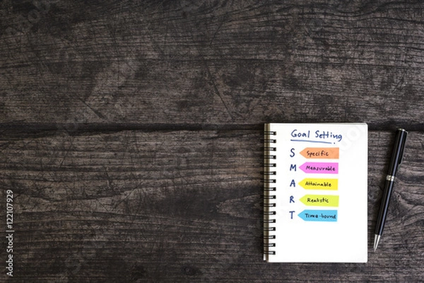 Fototapeta handwriting goal setting smart on open notebook