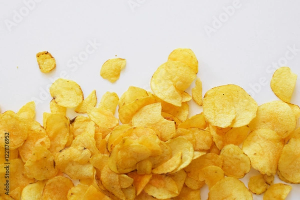 Fototapeta Crispy potato chips. Junk food, snacks on white background. Fast food.
