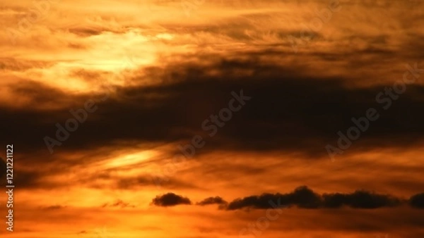 Fototapeta Cloudscape at extremely hot evening. Summer heat alert. Dark red sunset sky with bleeding red clouds. Dramatic view of a new scorch day in North America and heat wave.